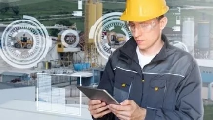 Worker with tablet in workshop